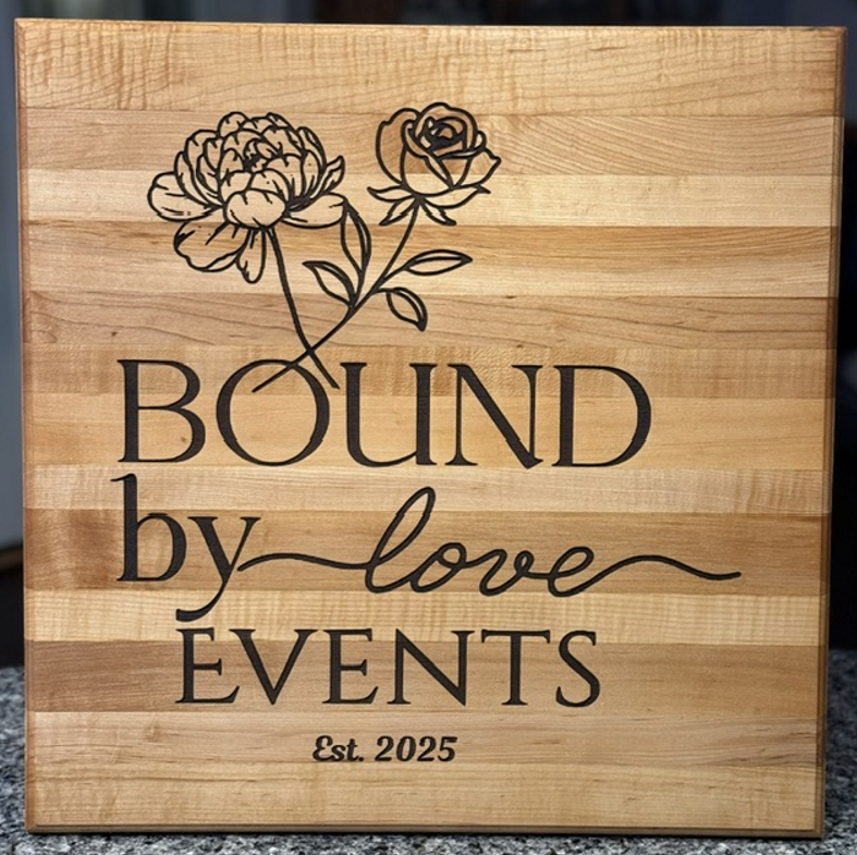 Custom engraved wooden board for Bound by Love Events with floral artwork